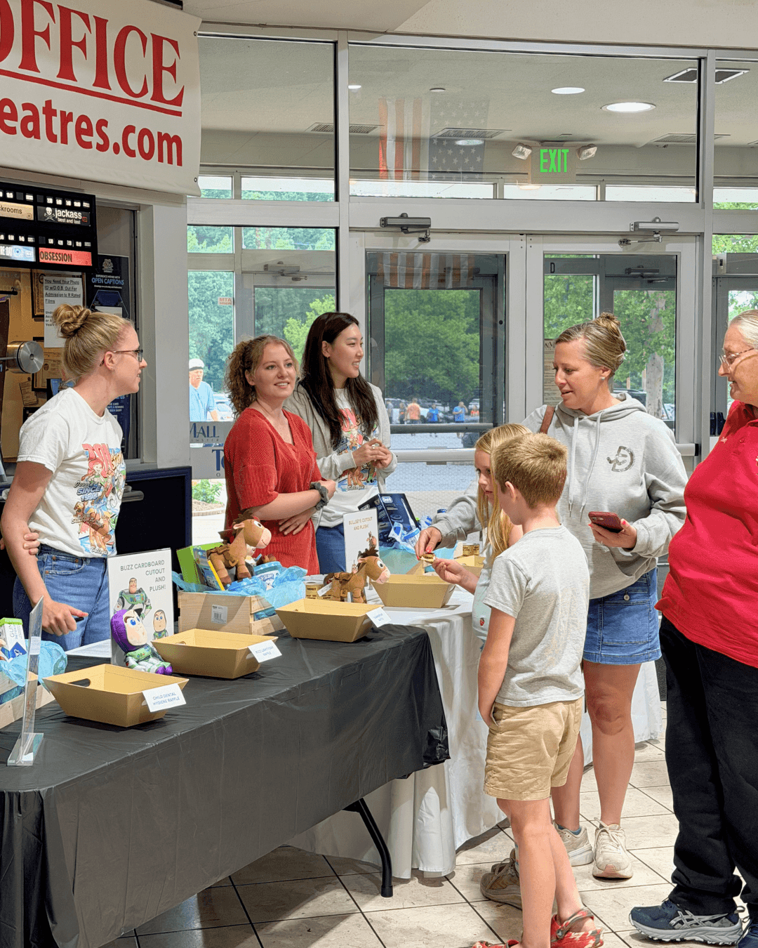 Guests meeting the PSJ Orthodontics team in the theater lobby